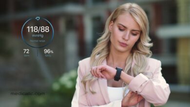 Woman monitoring blood pressure accuracy using smart watch with normal range results.