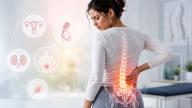 Woman holding her lower back with a highlighted spine and icons showing common causes of lower back pain in females