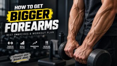 Muscular forearms holding dumbbells during a workout for building bigger forearms.